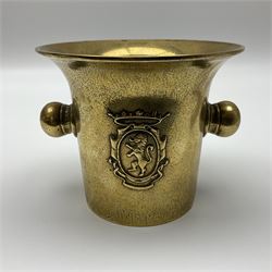 Victorian brass pestle and mortar, with twin handles, decorated in relief with lion rampant to either side, mortar H12cm