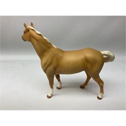 Collection of Beswick horses, including grey horse no.701, palomino foal no 836, grey stocky jogging mare no.855 etc, together two Royal Doulton horses, (8)
