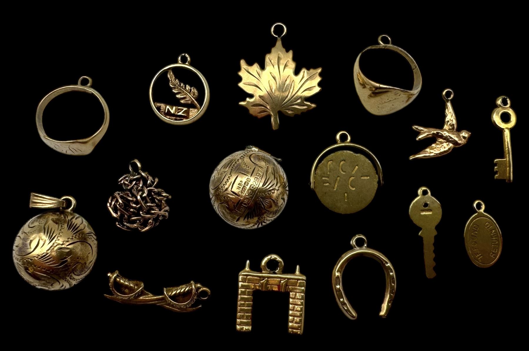 9ct gold charms, including crossed swords, signet ring, horseshoe and leaf, and a 14ct gold fireplace charm