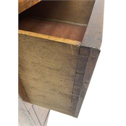 19th century mahogany linen press, projecting moulded cornice over figured frieze, enclosed by two panelled doors with geometric stringing, fitted with two short and one long cock-beaded drawers, on shaped apron and splayed bracket feet