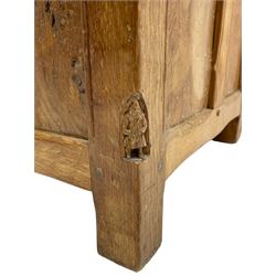 Gnomeman - oak blanket box, all-over adzing, the hinged top over figured and burr panelled front, decorated with carved crenellations and arcade, carved with gnome signature, pierced handles to each end forming the central rail, wrought metal hinges, on stile supports, by Tom Whittaker, Littlebeck, Whitby