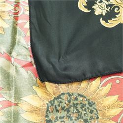 Hermès silk carré scarf, the black ground with central sunflower motif framed by ornate baroque panels and tassel borders in red, gold and yellow tones, signed Hermès Paris to the corner, hand-rolled edges, 90cm x 90cm
