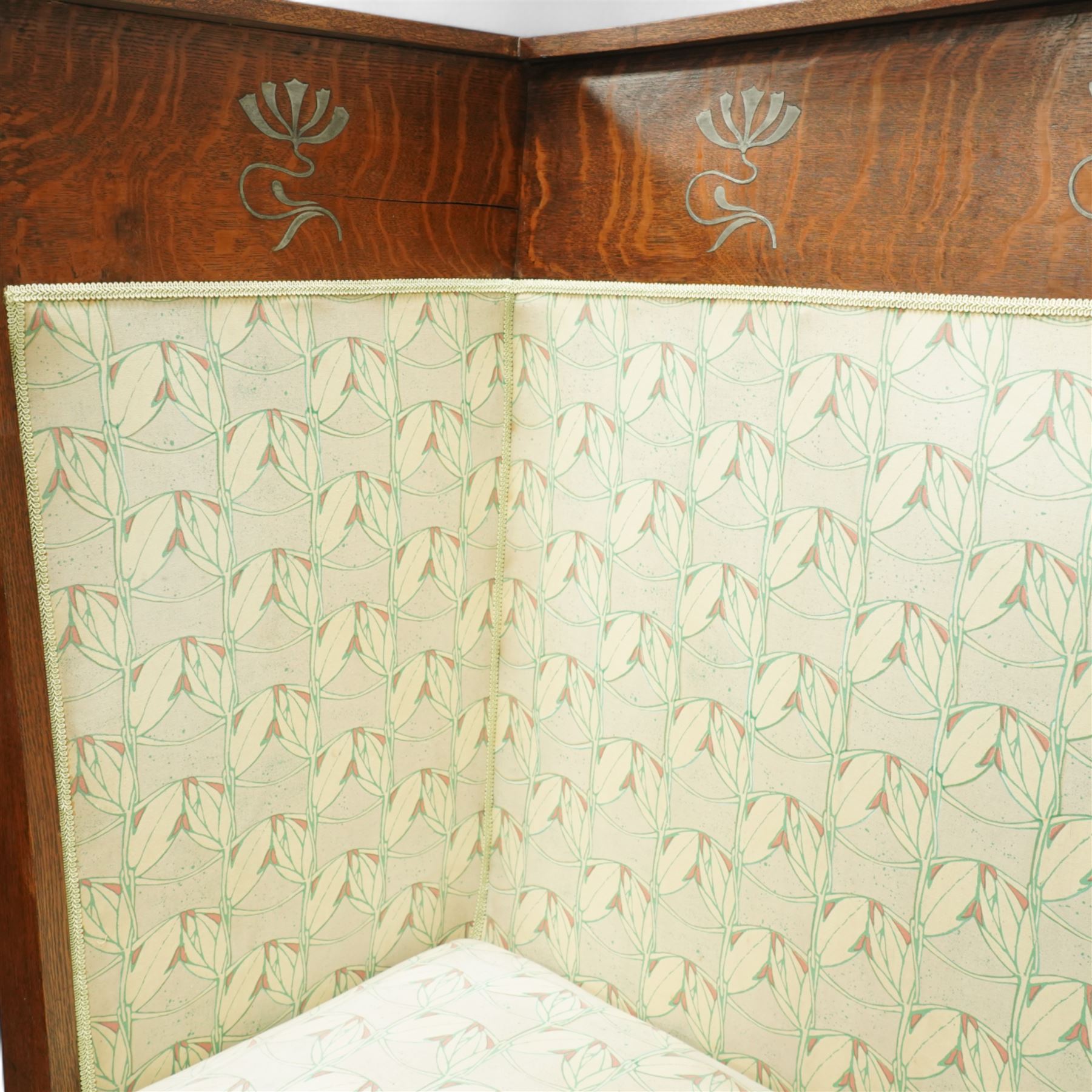 James Shoolbred & Co. (1814-1934) - Arts & Crafts high-back oak settle or hall-bench, the projecting cresting rail over a frieze decorated with stylised poppy pewter inlays, the drop-in sprung seat beneath high back and arms, flanked by tapering uprights terminating to shaped stile feet, upholstered in Archibald Knox patterned fabric with the original tapestry and horsehair upholstery beneath, applied plaque by James Shoolbred to underside, with stamped serial number W1573, circa 1890