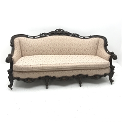 French style carved walnut framed three seat sofa upholstered in alight pink fabric with floral pattern, scrolling cabriole legs, W204cm