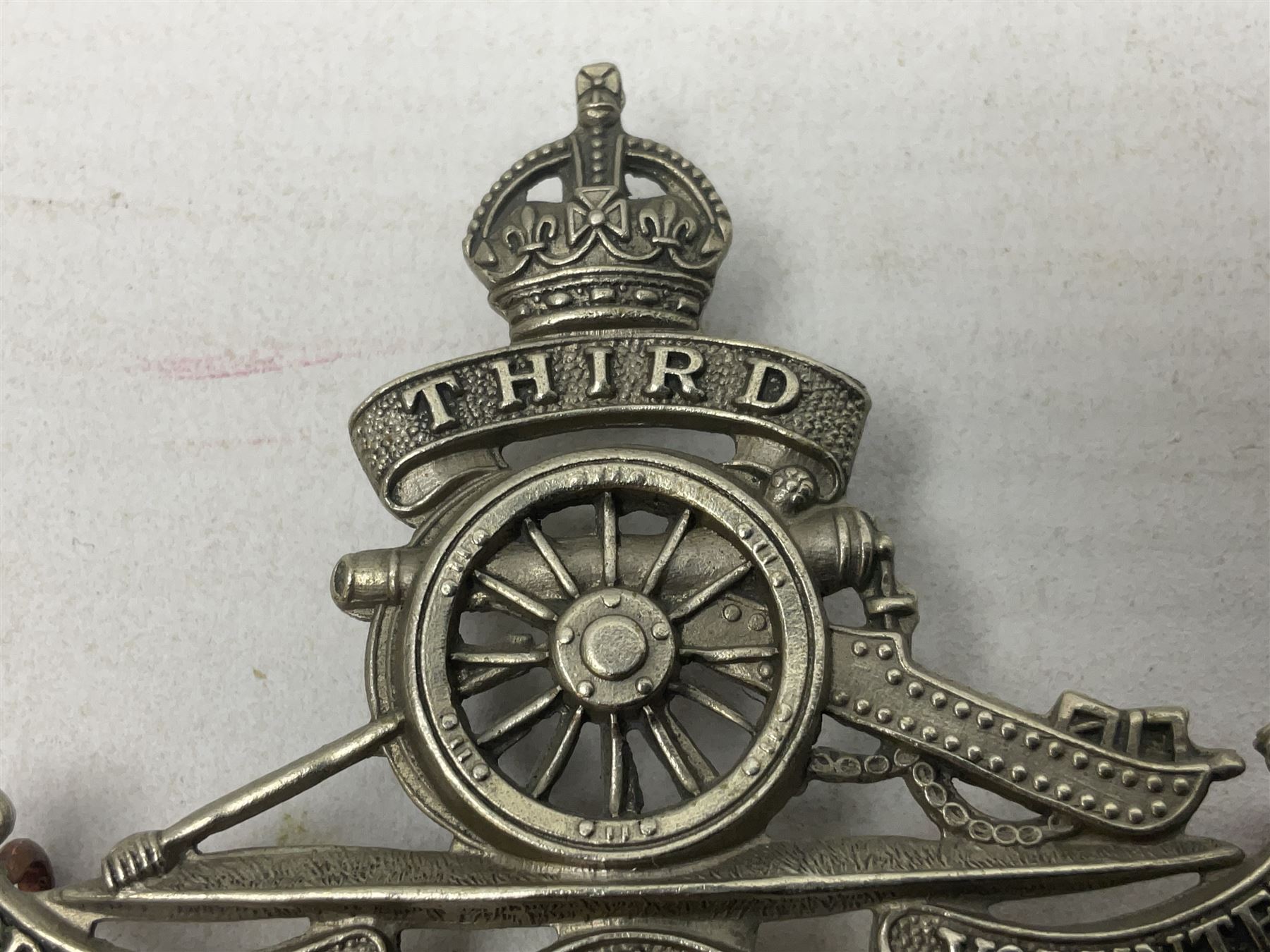 Third Middlesex Royal Garrison Artillery Volunteers Cap Badge, white meta Royal Artillery cap badge with “THIRD” to the top scroll and lower three part scroll “MIDDLESEX – R.G.A. – VOLUNTEERS”. Three lug fittings to the reverse.
