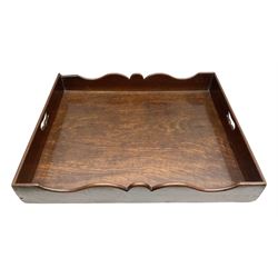 George III mahogany butlers tray, of rectangular form with raised and shaped gallery, and twin pierced handles, H9.5cm W61cm D50.5cm