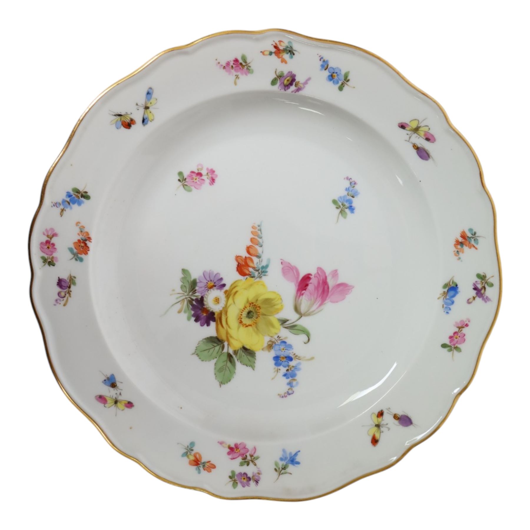 Four early 20th Century Meissen plates, hand painted with floral sprays, sprigs and inspects, with underglaze blue cross sword mark beneath, D21.5cm