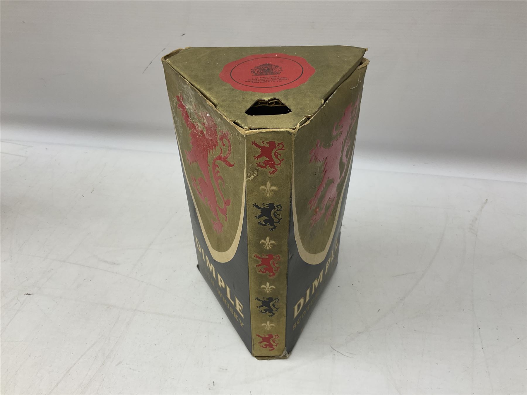 Four bottles of Haig's Dimple Old Blended Scotch whisky, all 26 2/3 Fl.OZs, 70 proof, one in original box and a bottle of East India 1961, Madeira, unknown contents and proof