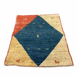 Baluchi rug, blue ground central lozenge, decorated with animal and figure
