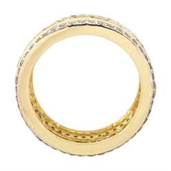 Gold yellow sapphire and diamond three row full eternity ring, channel set calibre cut sapphires, with a row of round brilliant cut diamonds set either side, stamped 9K, total sapphire weight approx 2.95 carat, total diamond weight 0.85 carat