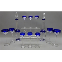  20th century Bohemian faceted glass liquor set with cobalt blue overlay, comprising pair decanters, four tall stem glasses and six slight smaller glasses (12)  