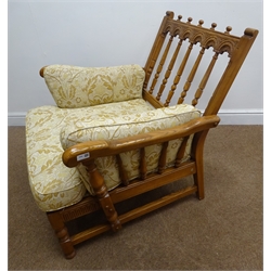  Ercol medium elm framed armchair, carved cresting rail, turned splat and legs joined by stretchers, upholstered with light gold floral back and seat cushions, W88cm  
