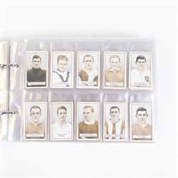 Collection of Edwardian and later Football related trading and cigarette cards, including forty-nine of fifty 1906 Ogden's Football Club Colours, 1922 PALS Footall series, ninety of one hundred 1925 Gallaher Famous Footballers, complete set of forty-four 1926 Ogden's Captains of Association Football Clubs and Colours, complete set of fifty 1927 Players Football Caricatures by MAC,  complete set of fifty 1927 Players Football Caricatures by RIP,  complete set of fifty 1930 Players Association Cup Winners, complete set of 50 1933 Ogdens AFC Nicknames etc, housed in brown cigarette card album