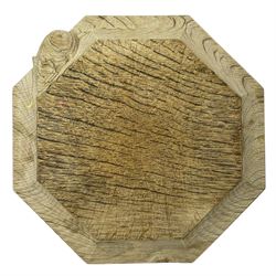 Mouseman - figured oak chopping board or kettle stand, octagonal form with moulded edge carved with mouse signature, by the workshop of Robert Thompson, Kilburn, W19cm 