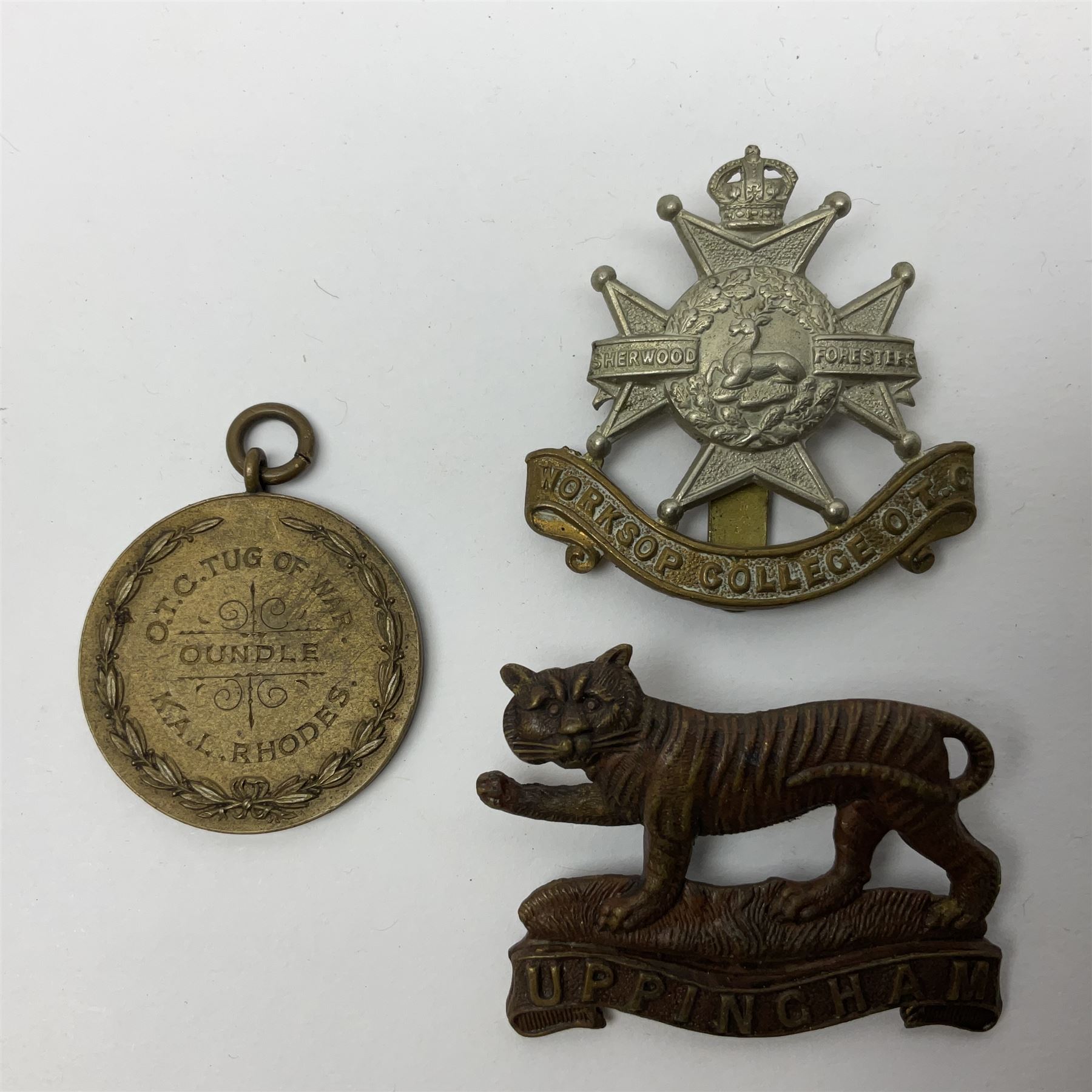 WW1 pair of medals awarded to 151761 Gnr. S. Loten R.A. with ribbons; four WW2 medals with ribbons; and small quantity of cap badges, medallions etc