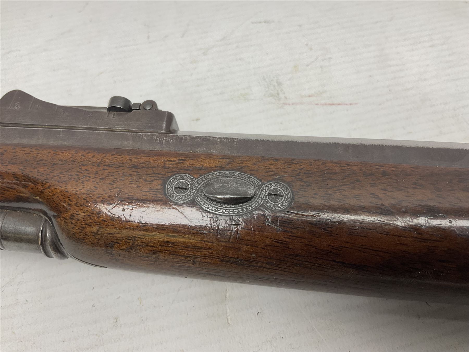 Mid-19th century percussion rifle by Geo. Forrest & Sons of Jedburgh No.844, 79cm octagonal barrel (approx .45 bore) with folding foresight, the lock plate with dolphin hammer finely engraved with a tiger and a stag, trigger guard engraved with hounds chasing a stag, figured walnut half stock with chequered grip and original ramrod 121cm overall; with framed photograph of original owner Dr. A.B. Dresser and archive of related ephemera including manuscript letter from the makers to Dr. Dresser regarding the sight specifications.
