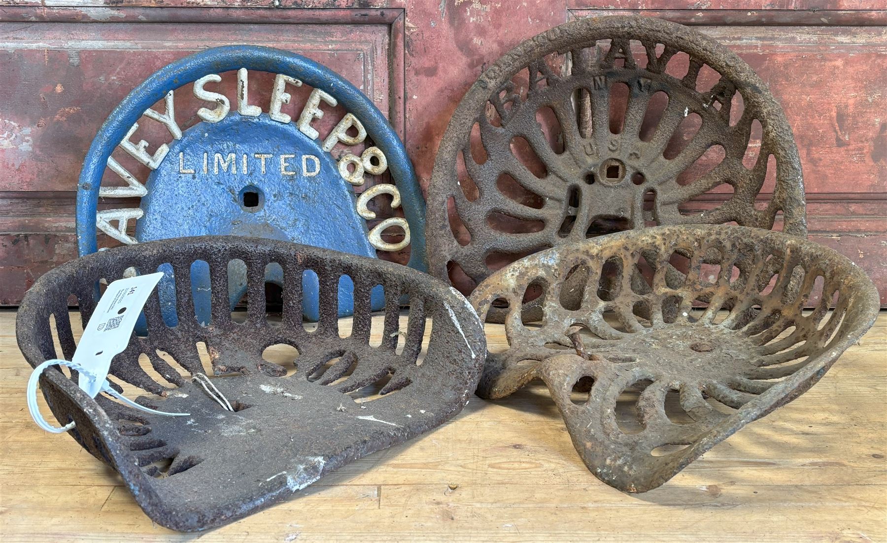 Four late 19th / early 20th century cast iron farm implement seats, Kearsley & Co. of Ripon, Davey Sleep & Co. Nicholson, and a Batavia USA, largest W33cm (4) - COLLECTION BY APPOINTMENT FROM: The White House, Thirsk Road, Easingwold, York, YO61 3NF - CALL 01723 507111 TO ARRANGE