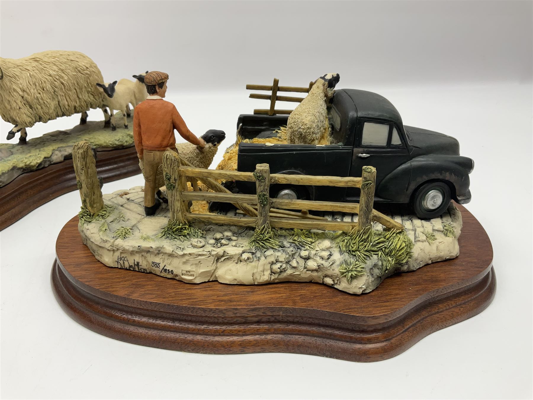 Two Border Fine Arts figure groups, comprising Black faced Ewe & Border Collie no B104 by Ray Ayres and To The Tup Sale, no JH72 limited edition 383/1850, both on wooden base, one with certificate