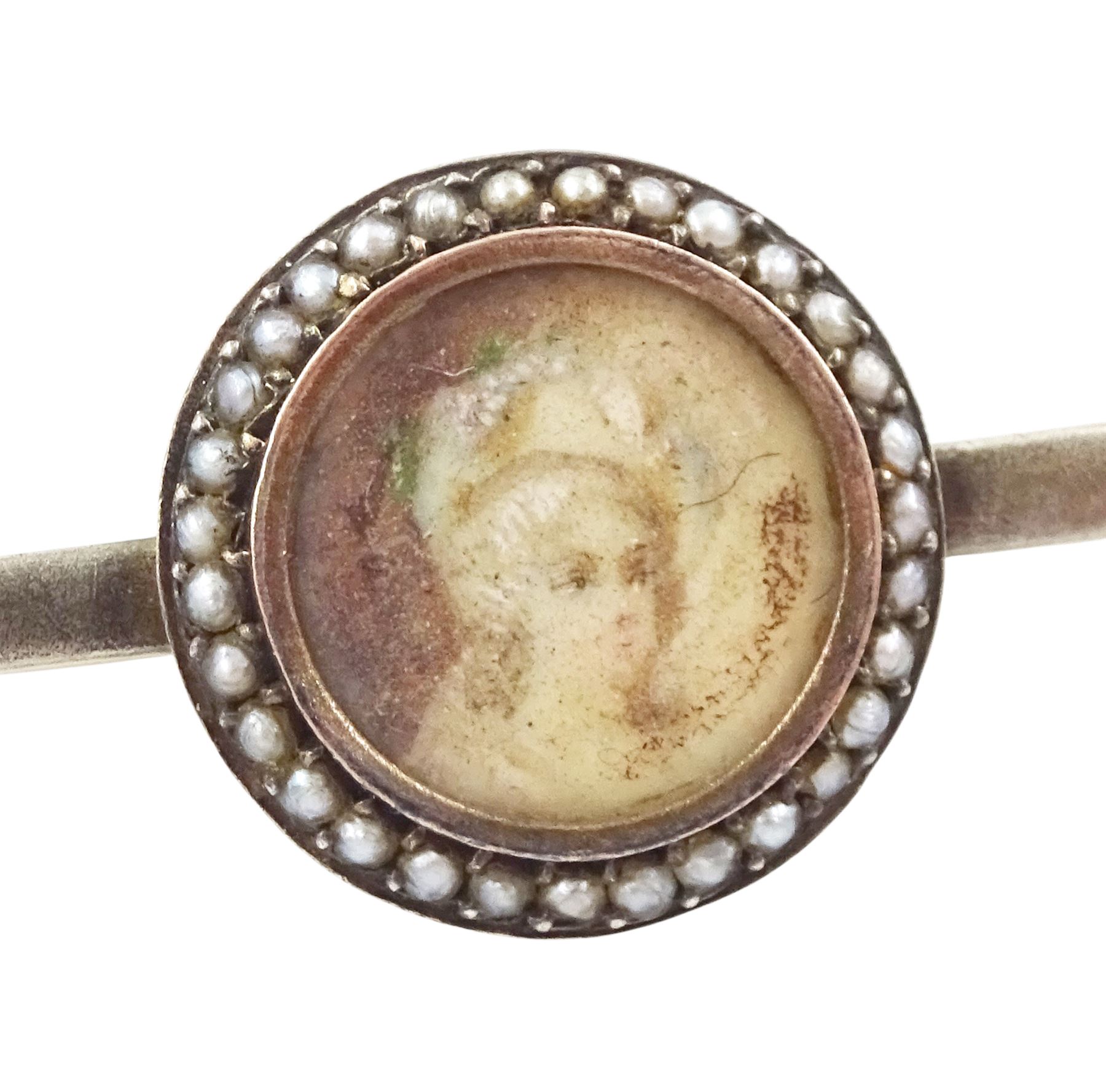 19th/ early 20th century silver portrait miniature jewellery including a pearl set pendant painted with a cherub, a ring painted with a young girl wearing a bonnet and brooch with seed pearl surround, all on ivory. This lot has been registered for sale under Section 10 of the APHA Ivory Act