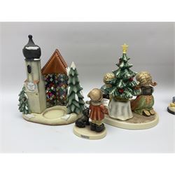 Eight Christmas Hummel figures by Goebel, to include Wintertime Chapel candle holder, Winter Fun, Christmas Morning, Christmas Time and Gingerbread Lane, tallest H21cm
