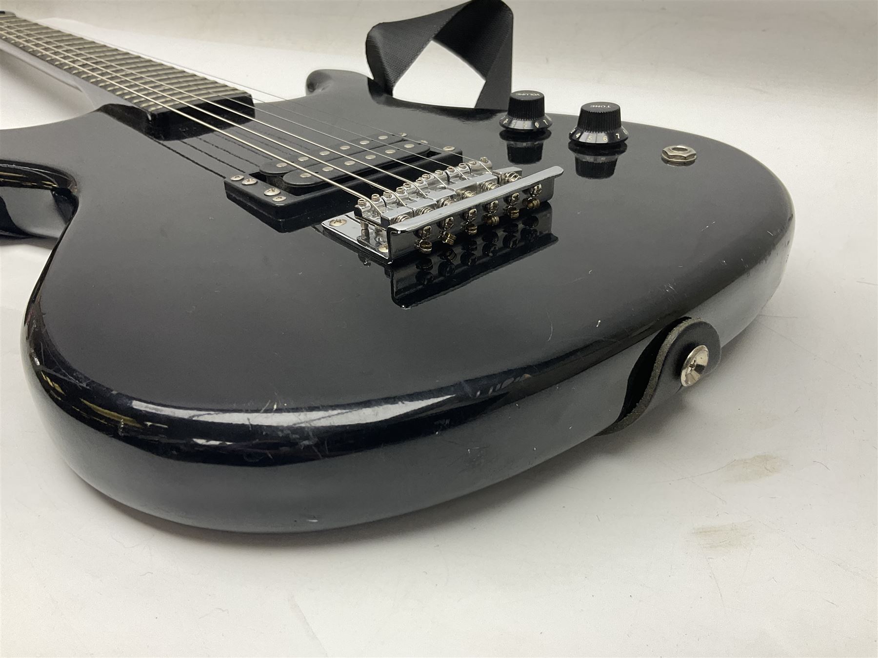 Encore black electric cut-away guitar L96cm; and Spanish Victor Garcia model 187 acoustic guitar, bears label dated 1972 L99cm; each in soft carrying case (2)