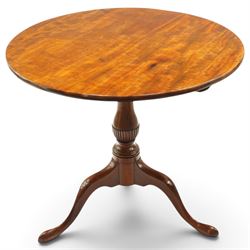 George III mahogany tilt-top tripod table, the circular figured top raised on a turned and tapering column with half-reeded lower section, over three splayed cabriole legs terminating in pad feet

Notes: several tables made by York cabinet maker John Walker for Harewood House share the same half reeded column, after the original drawing by Thomas Chippendale (c.f. The Life and Works of Thomas Chippendale, Christopher Gilbert, 1978, p.264)