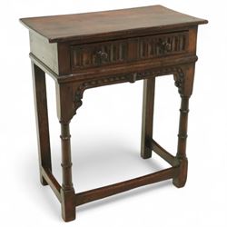 Titchmarsh & Goodwin style oak side table, rectangular top above a carved frieze drawer fitted with turned knobs, raised on block and baluster legs with plain stretchers 
