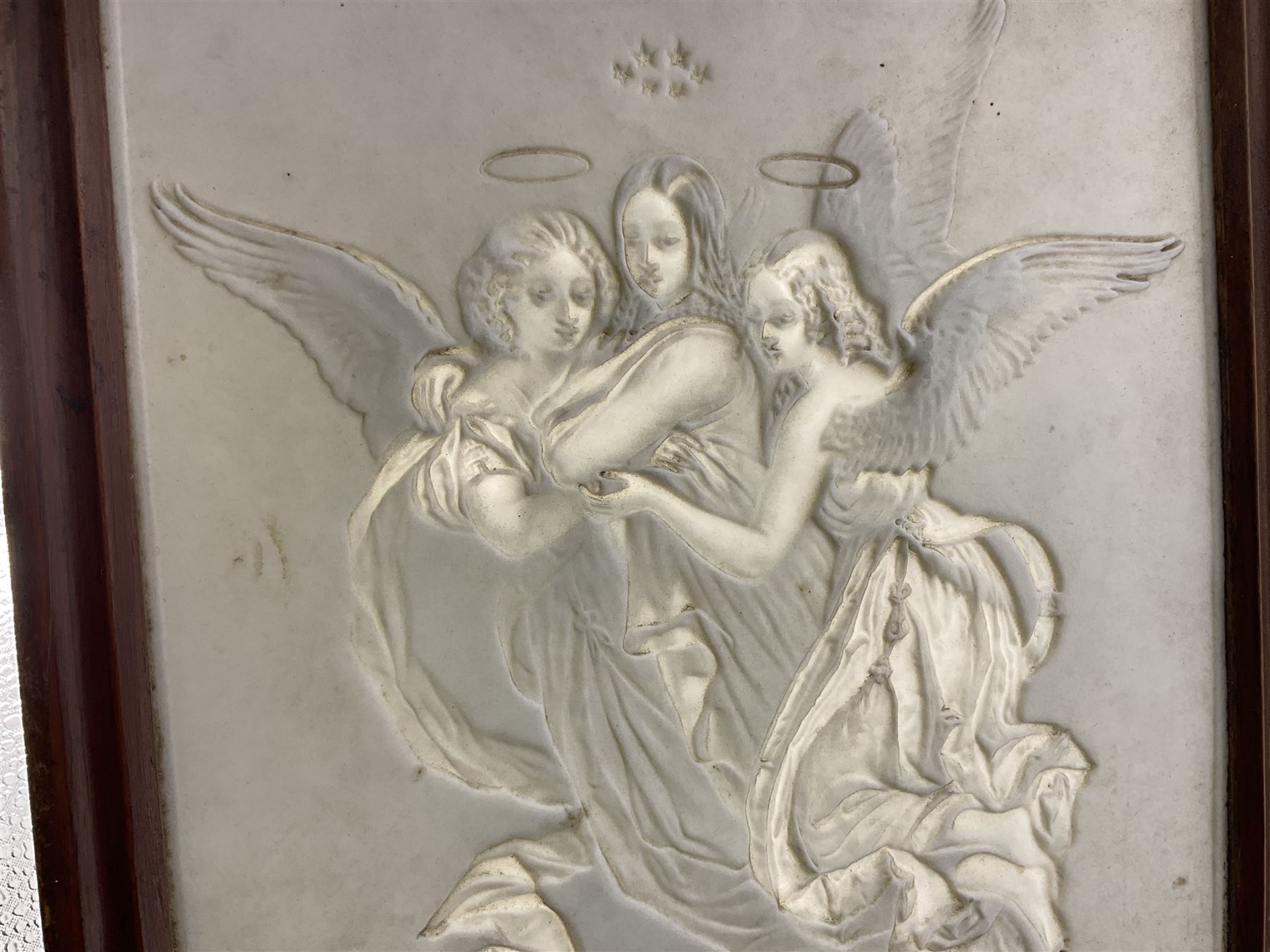 KPM Berlin lithophane panel, of two angels supporting a female figure to the centre, encased in a rosewood frame and handle, H42cm