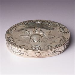 Edwardian silver oval dressing table box, the hinged cover embossed with angel heads W10cm London 1902 Maker William Comyns & Sons and an Edwardisn pierced silver oval sweetmeat basket L18cm Sheffield 1907 Maker James Dixon & Sons Ltd