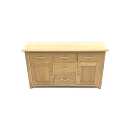 Light oak sideboard, five drawers and two cupboards, stile supports