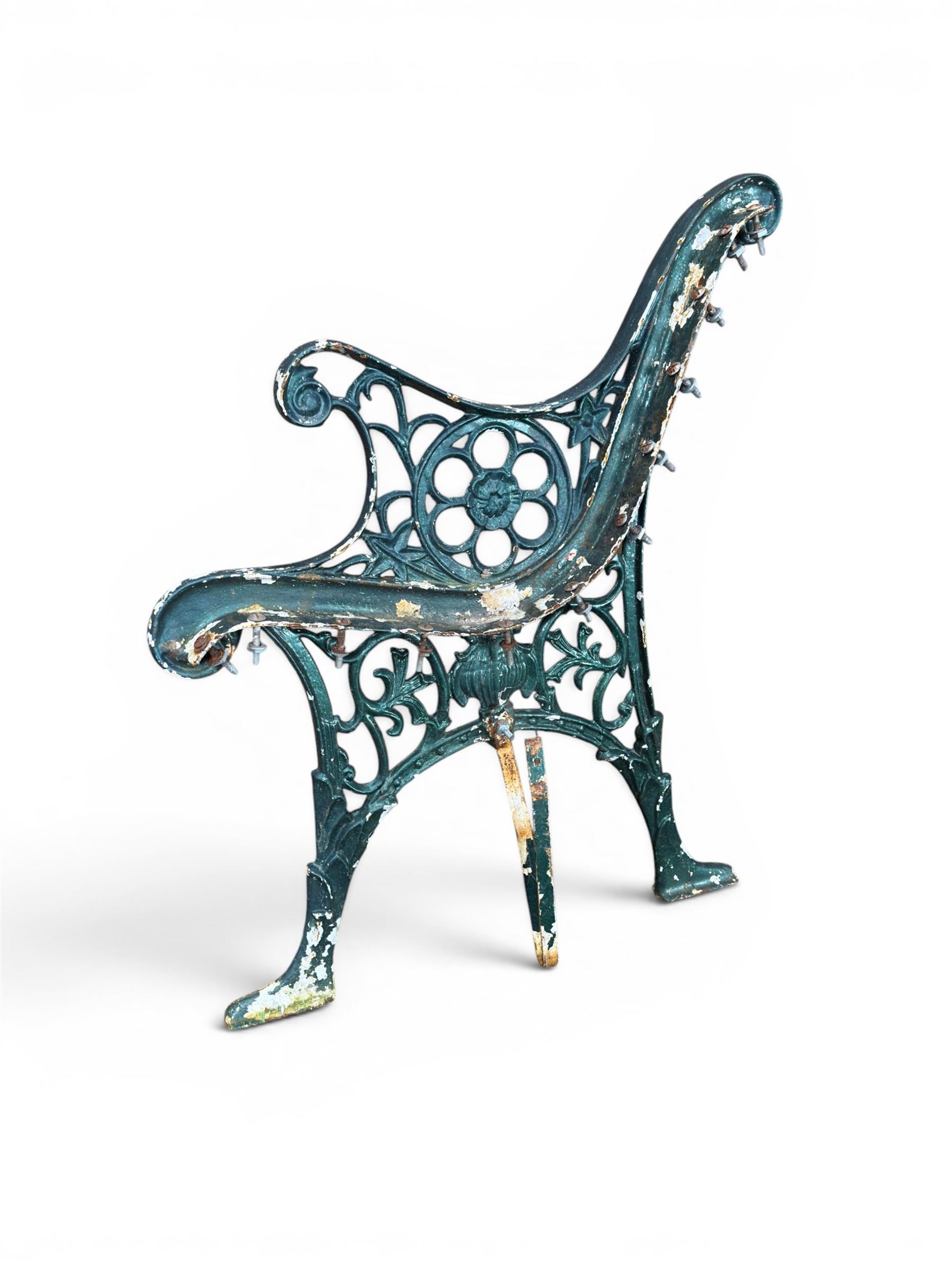 Pair of ornate painted cast iron bench ends, painted in green