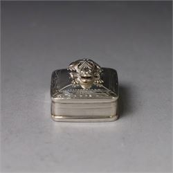 Modern silver pill box, of square form, the hinged cover surmounted with figure of a frog within a engraved scroll edge, hallmarked hallmarked Martin Gerald & Sid Adler, London 2000, W3cm