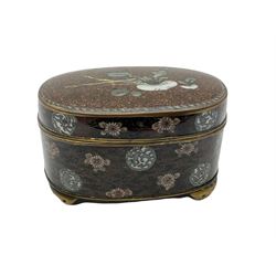 Late 19th century Chinese cloisonné box and cover, of cylindrical form decorated with prunus blossom, H8cm, together with an early 20th century Japanese cloisonné box and cover, of oval form upon four lobed feet, decorated with stylised flowers and motifs against a copper foil type ground, H7cm L12.5cm