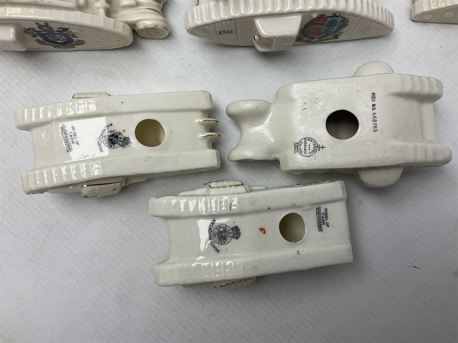 Twelve crested china models of WW1 tanks by Grafton, Arcadian and Carlton china etc with crests from Caistor Lincs, Saffron Walden, Paignton, Evesham etc  , together with a crested china model of the R.M.S Lusitania with New Brighton crest and a two-handled vase for 'The Forts Boxhill' (14)