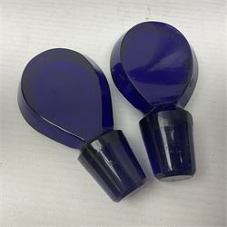 Pair of early 19th century blue glass decanters with teardrop stoppers, with gilt writing, the first marked Gin the second Brandy 