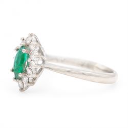 18ct white gold emerald and diamond cluster ring, single marquise cut emerald 0.25 carat, surrounded by twelve round brilliant cut diamonds, London 1979, total diamond weight approx 0.25 carat