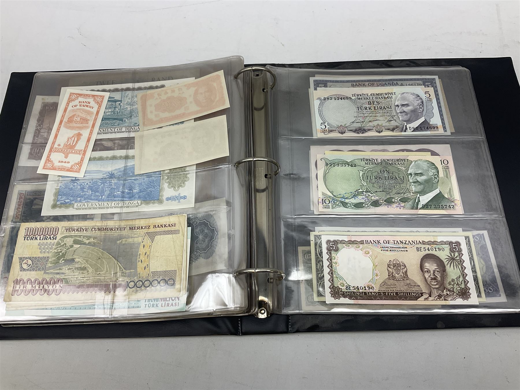 World banknotes, including Queen Elizabeth II The States of Jersey one pound 'DB202703', five pounds 'BB527762' and ten pounds 'AB651481', reserve bank of New Zealand two dollars '1L3 741894', King George V Straits Settlements one dollar 1st January 1935 'F/83 28924', various Bank of England notes etc, housed in two ring binder albums