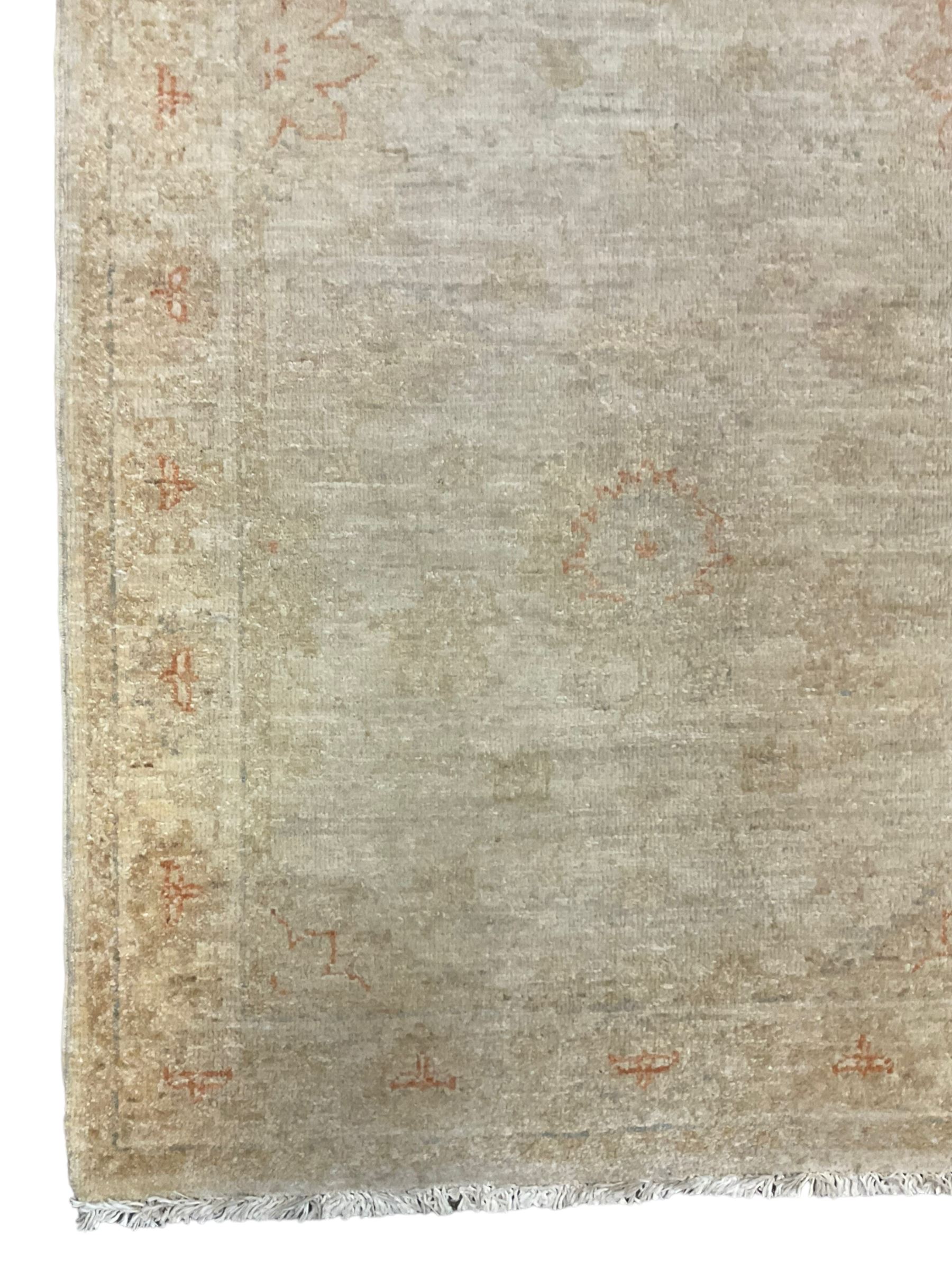 Persian Zeigler runner, ivory ground decorated with faint floral design 