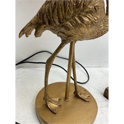 Brass ashtray stands, the barley twist example with matchbox holder, a composite table lamp with beaded tassel shade and another modelled as a flamingo (4)