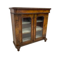 Victorian walnut display cabinet, fitted with two glazed doors