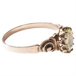 Gold single stone opal ring with scroll embossed shoulders