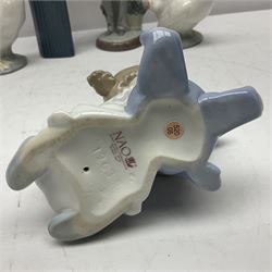 Two Lladro figures, Over the Threshold no 5282 and Prayful Moment no 5500 together with five Nao figures