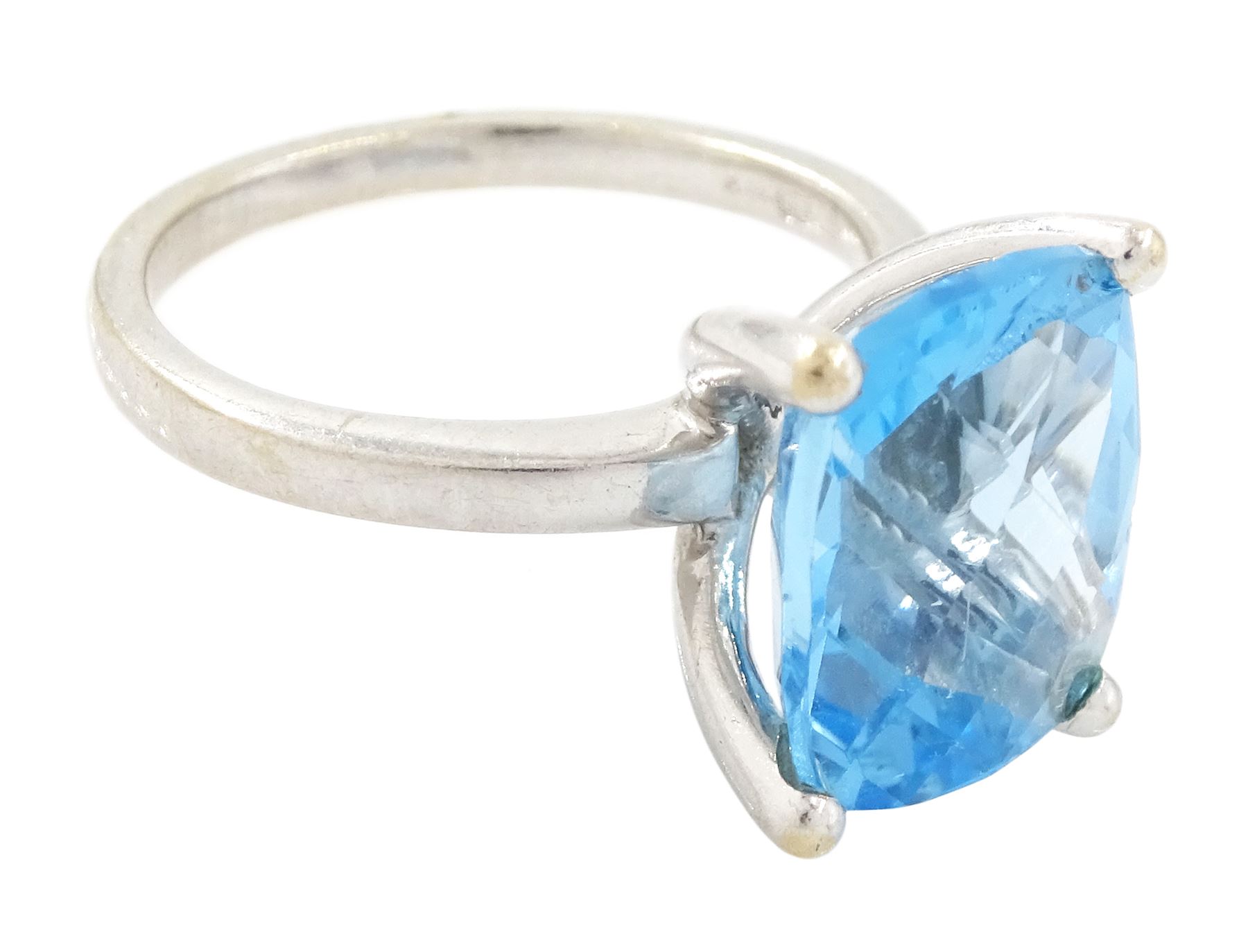 18ct white gold blue topaz ring, four claw set with a single cushion briolette cut Swiss blue topaz, hallmarked
