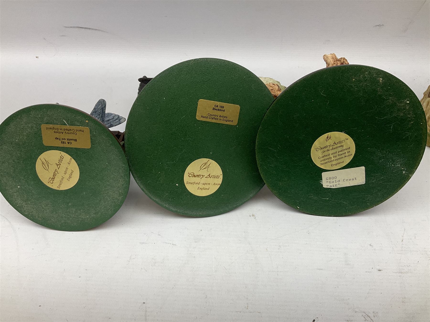 Three Country Artist figure groups, comprising 'Woodland Visitors', 'Bluetit on Tap' and 'Blackbird', together with two other animal figure groups