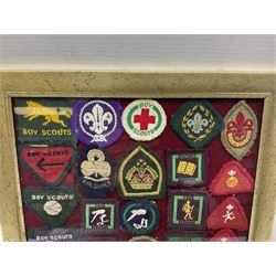 Boy Scout Interest; framed collection of Boy Scouts cloth insignias, to include badges from East Yorkshire, Northumberland, West Yorkshire, Devon, Norfolk and Derby, thirty four badges in total  