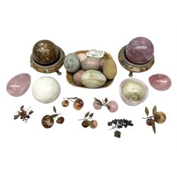Collection of marble, agate, quartz, onyx and stone eggs, together with two stands, berries etc