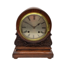  20th century Regency style oak cased arched top bracket clock, circular silvered Roman dial and brass bezel, twin train movement striking the quarter hours on two coils, scroll carved case on bun turned feet,with pendulum and key, H29cm, W25cm,   