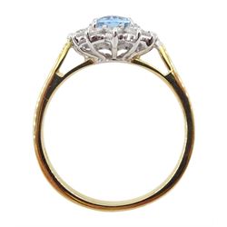18ct gold oval aquamarine and round brilliant cut diamond cluster ring, hallmarked, aquamarine approx 0.90 carat, total diamond weight approx 0.40 carat
