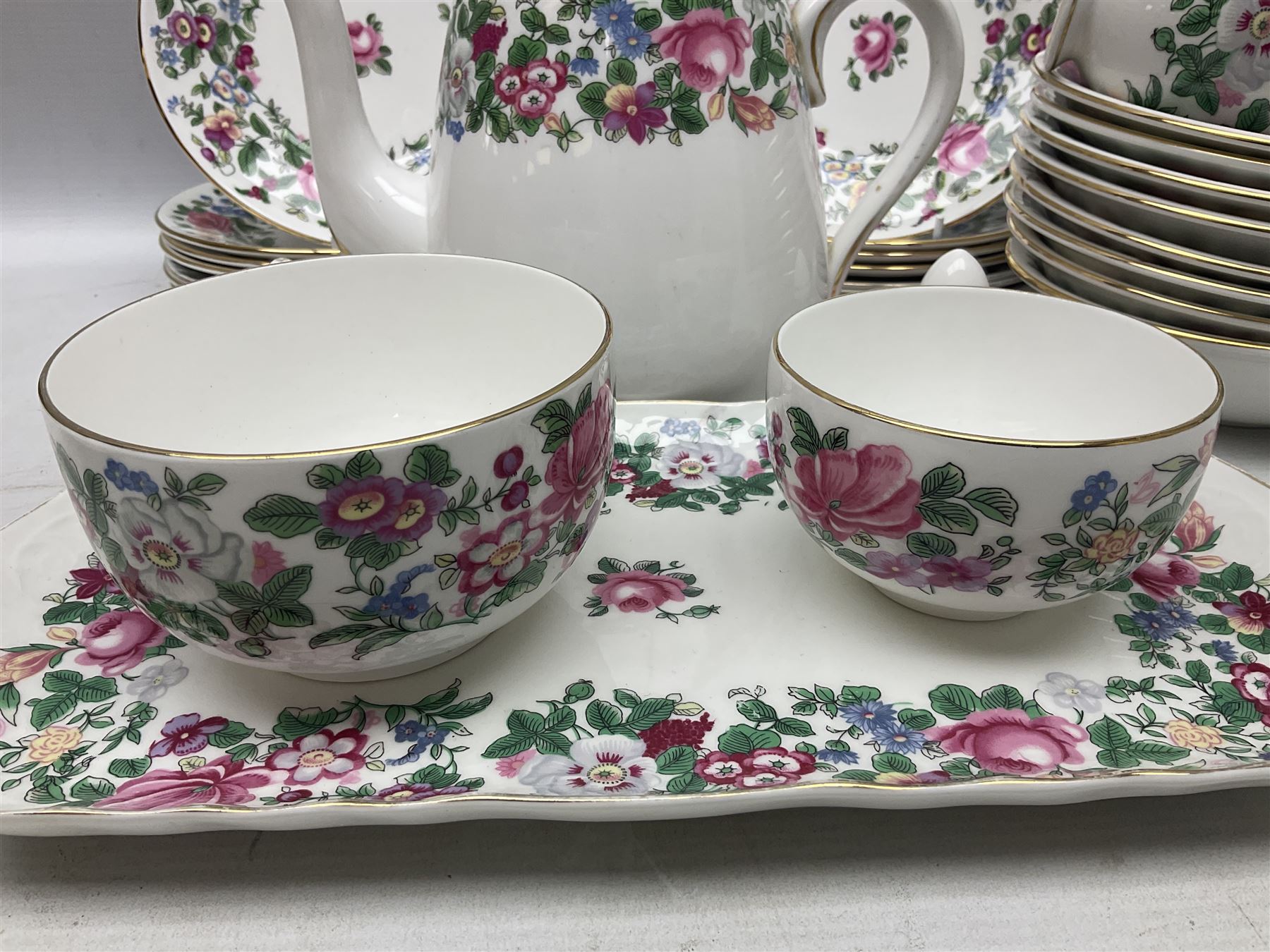 Crown Staffordshire Thousand Flowers pattern part tea service, to include teapot, two open sucriers, eighteen cups, fifteen saucers etc (57)