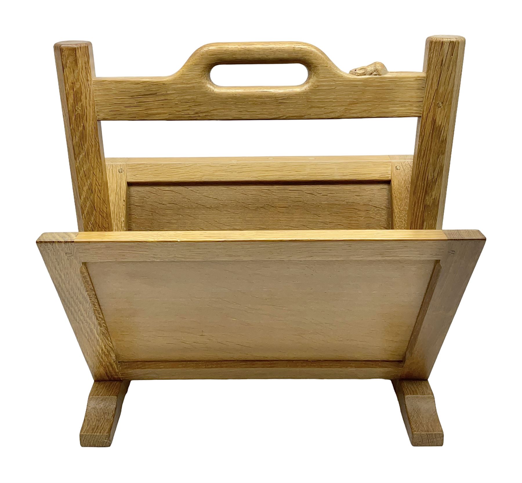 Mouseman - oak magazine rack, the top rail pierced with handle and carved with mouse signature, octagonal supports with two panelled and splayed sides, on sledge feet, by the workshop of Robert Thompson, Kilburn 